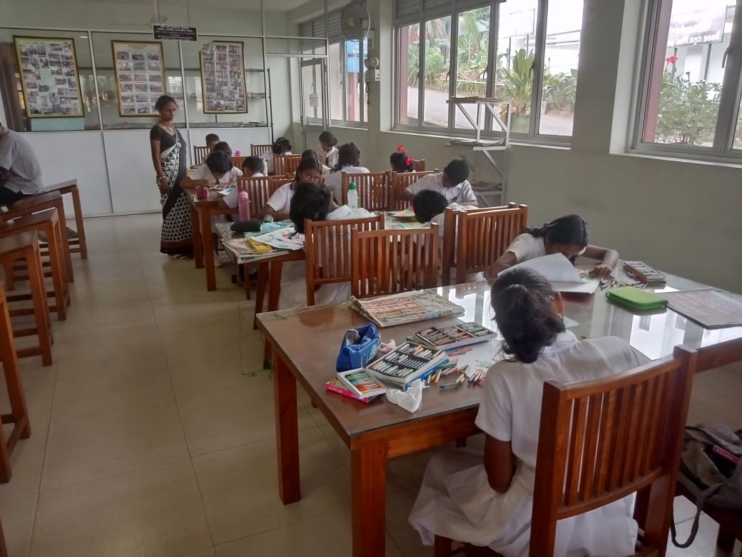 Five cats looking around a field.