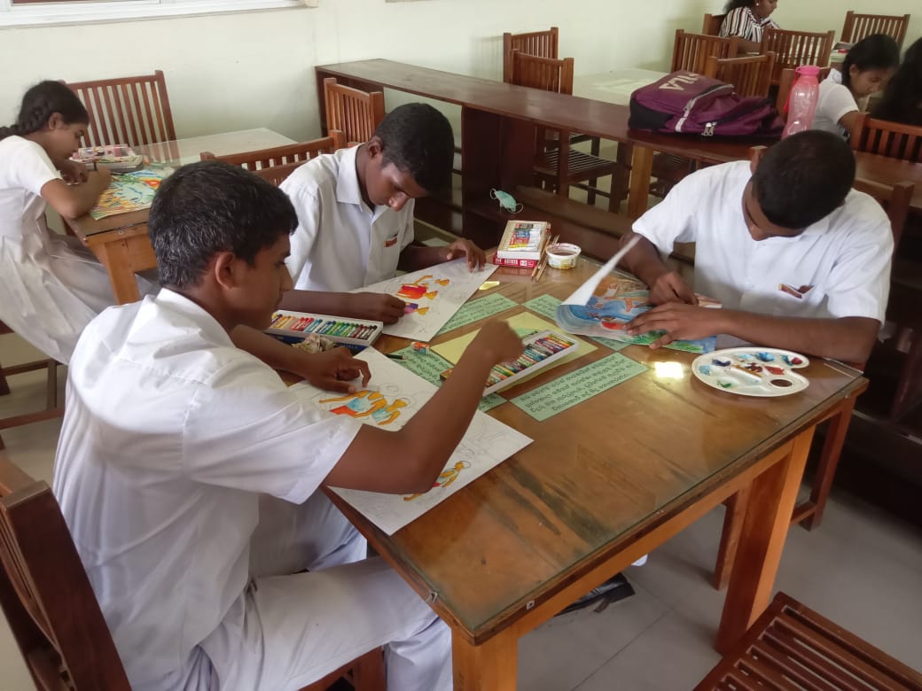 Five cats looking around a field.