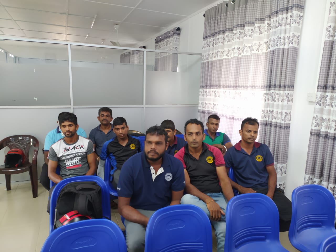 Five cats looking around a field.