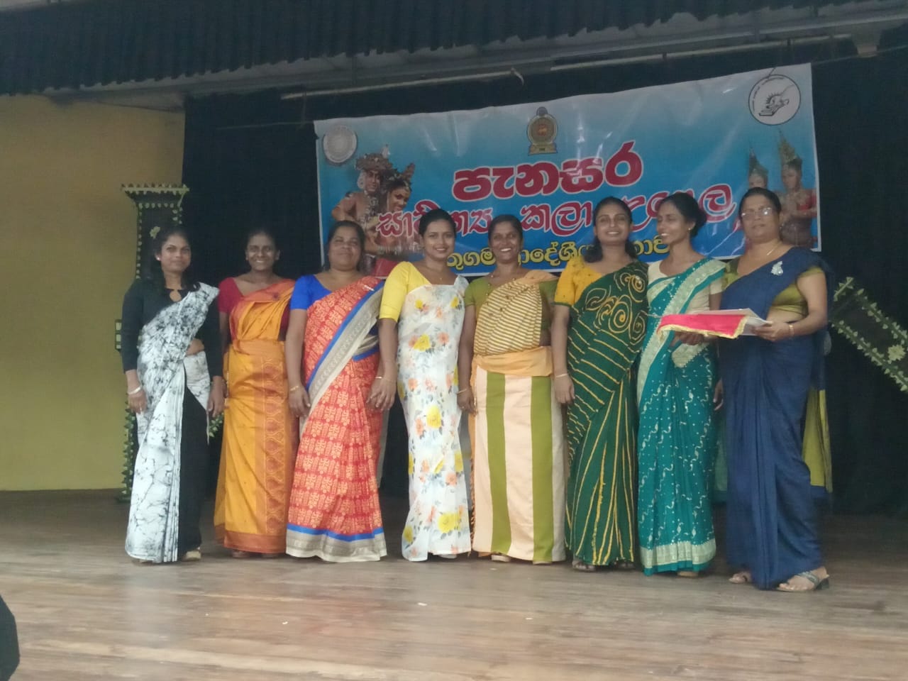 Five cats looking around a field.